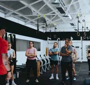 Members and coach talking